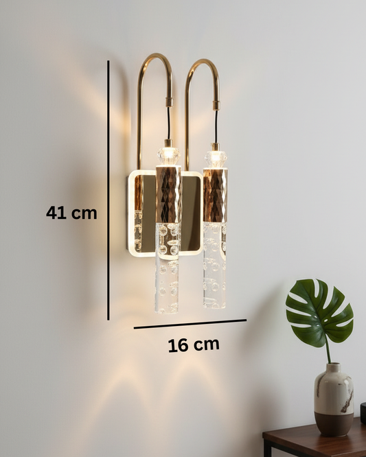 Swanart modern LED crystal wall light with gold finish and decorative bubble crystals, mounted on a wall in a living room setting