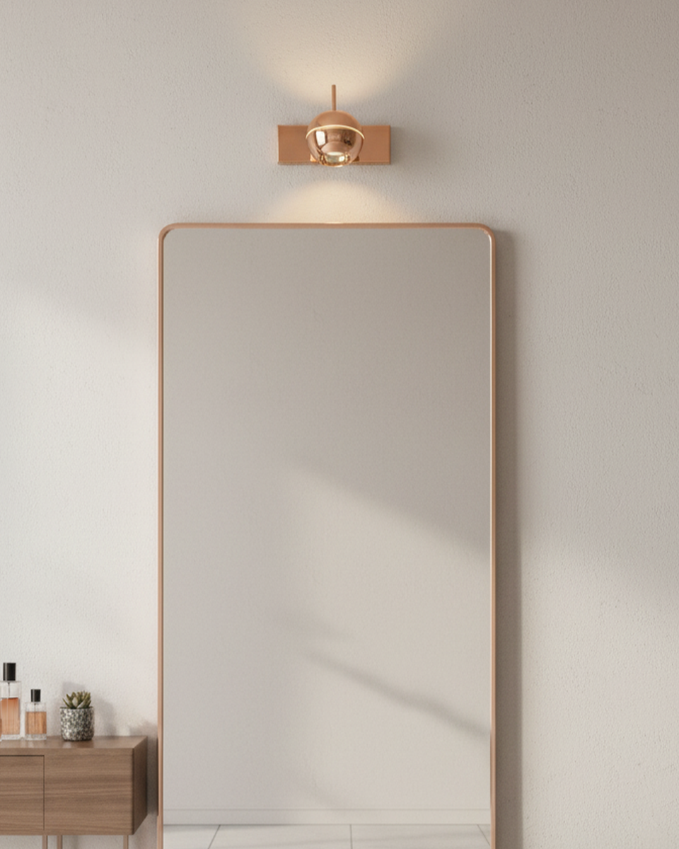 Modern Swanart rose gold wall sconce with adjustable LED globe shade, ideal for living rooms, bedrooms, and office decor.