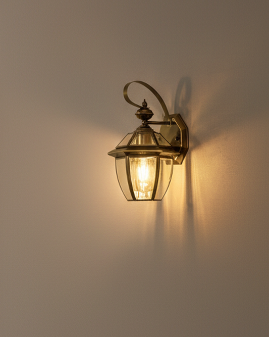 Swanart outdoor wall lantern in vintage brass finish, waterproof exterior sconce with clear glass for porch or patio lighting.