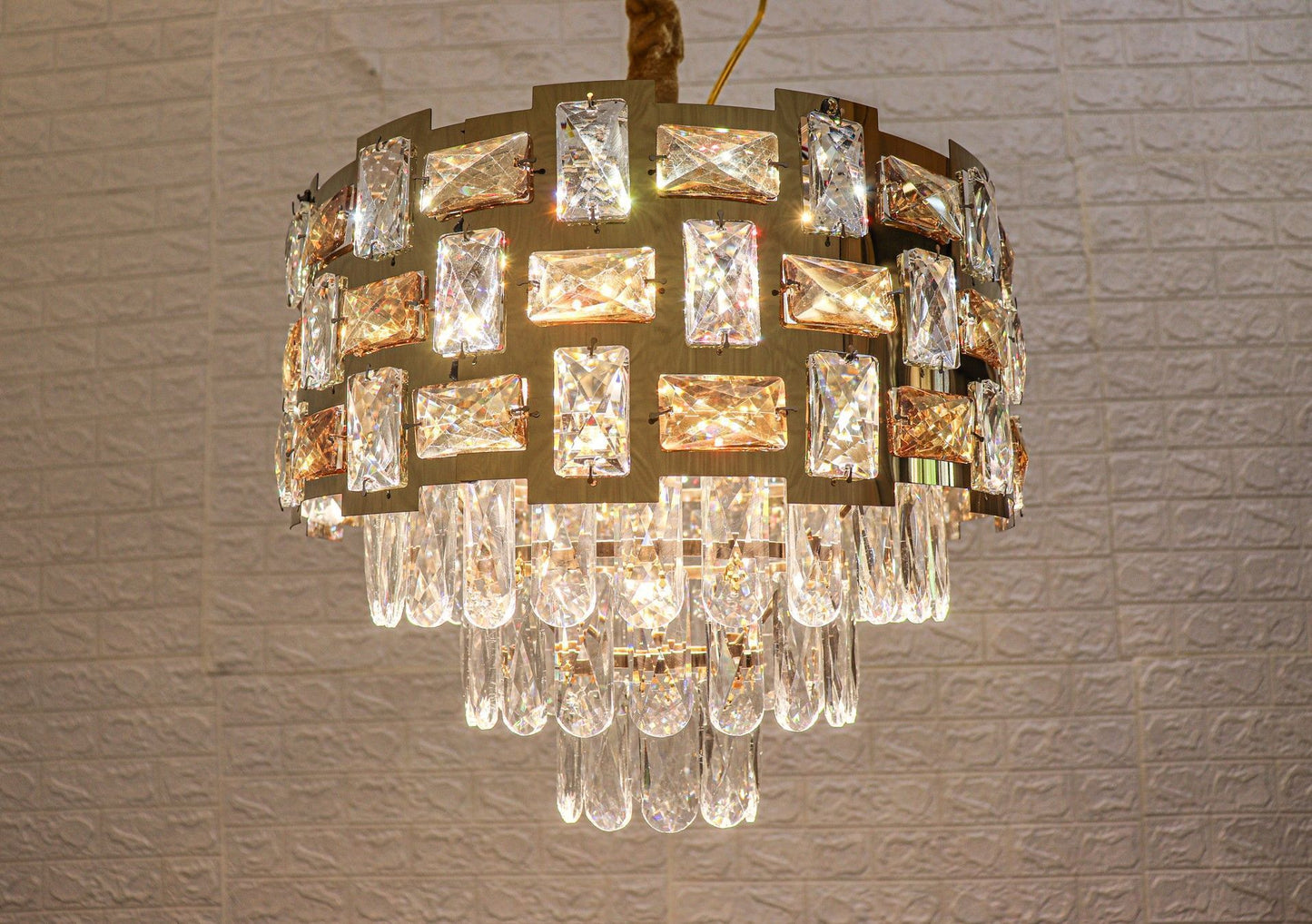 Swanart Dazzling Cascade 3-tier crystal pendant light with sparkling glass droplets hanging from a metal frame.