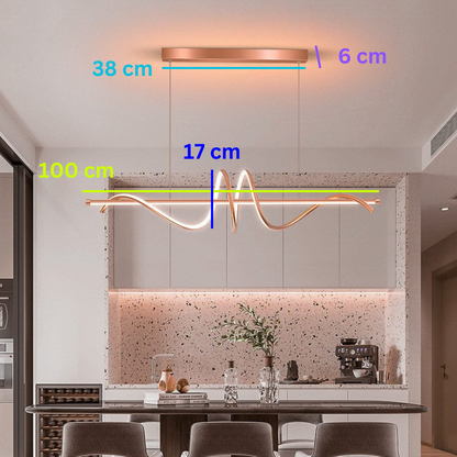 Swanart Modern Wave LED pendant light hanging over a dining table, 100cm gold and rose gold designer chandelier for kitchen island.