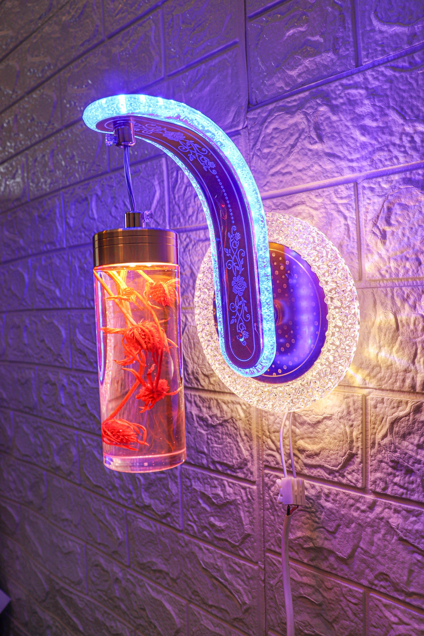 Swanart wall light fixture with sleek design, illuminating a modern room with warm ambient lighting.