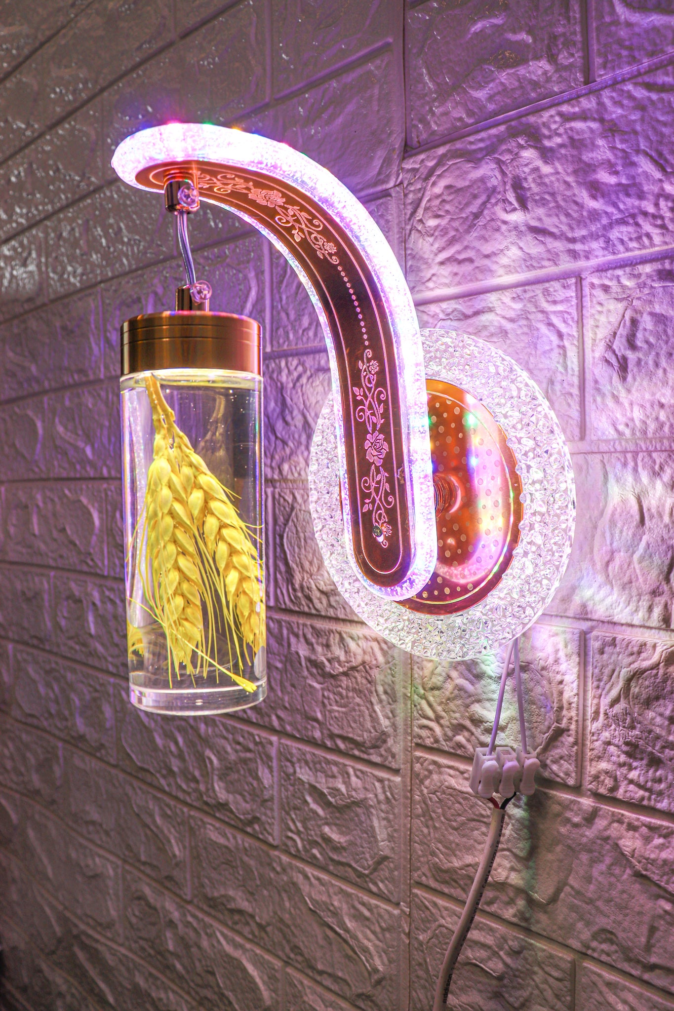 Swanart multi-colour flower LED wall light with floral design illuminating a modern living space for elegant ambiance.