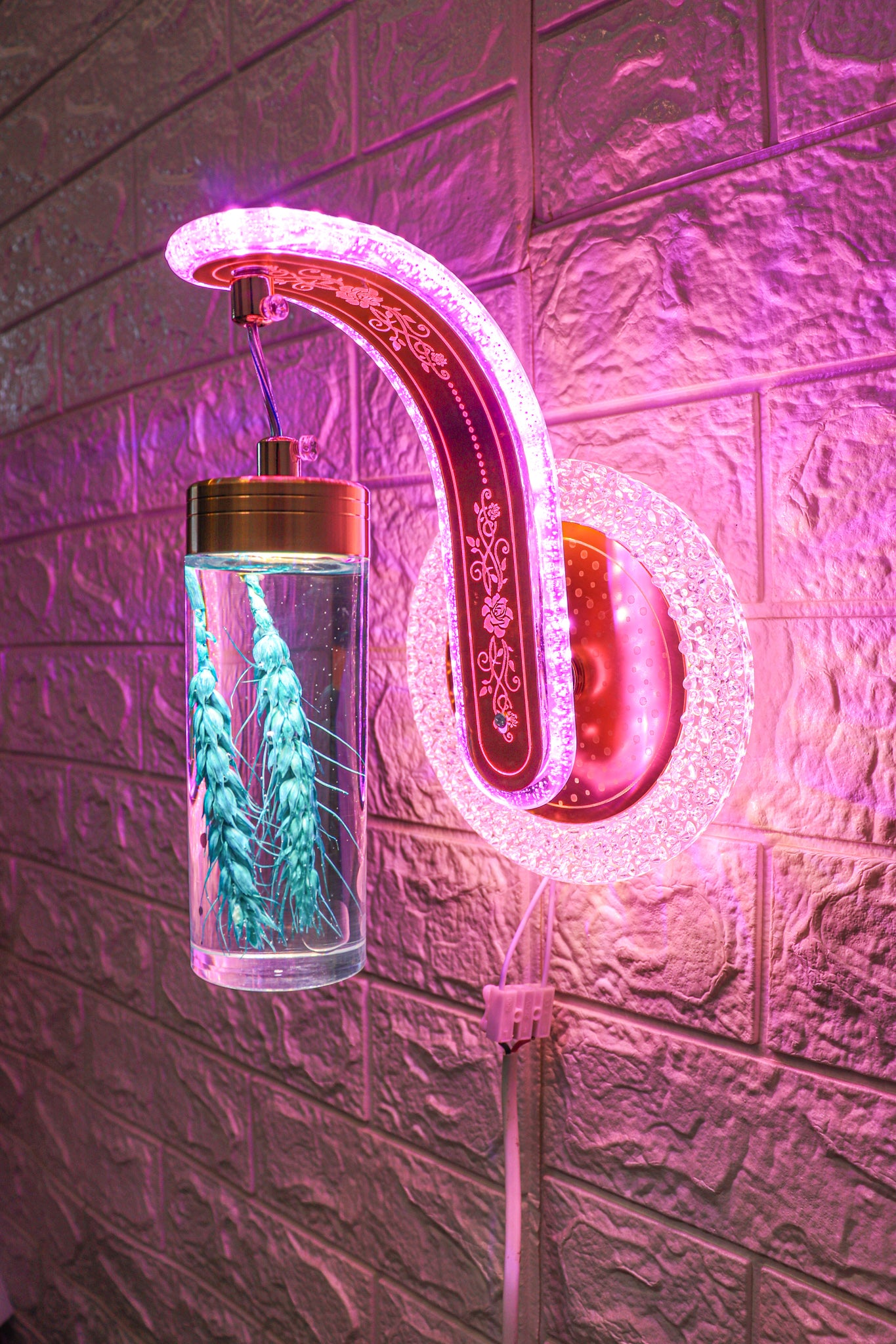 Swanart color-changing wall light displaying vibrant hues on a modern wall, showcasing its versatile lighting transformation.