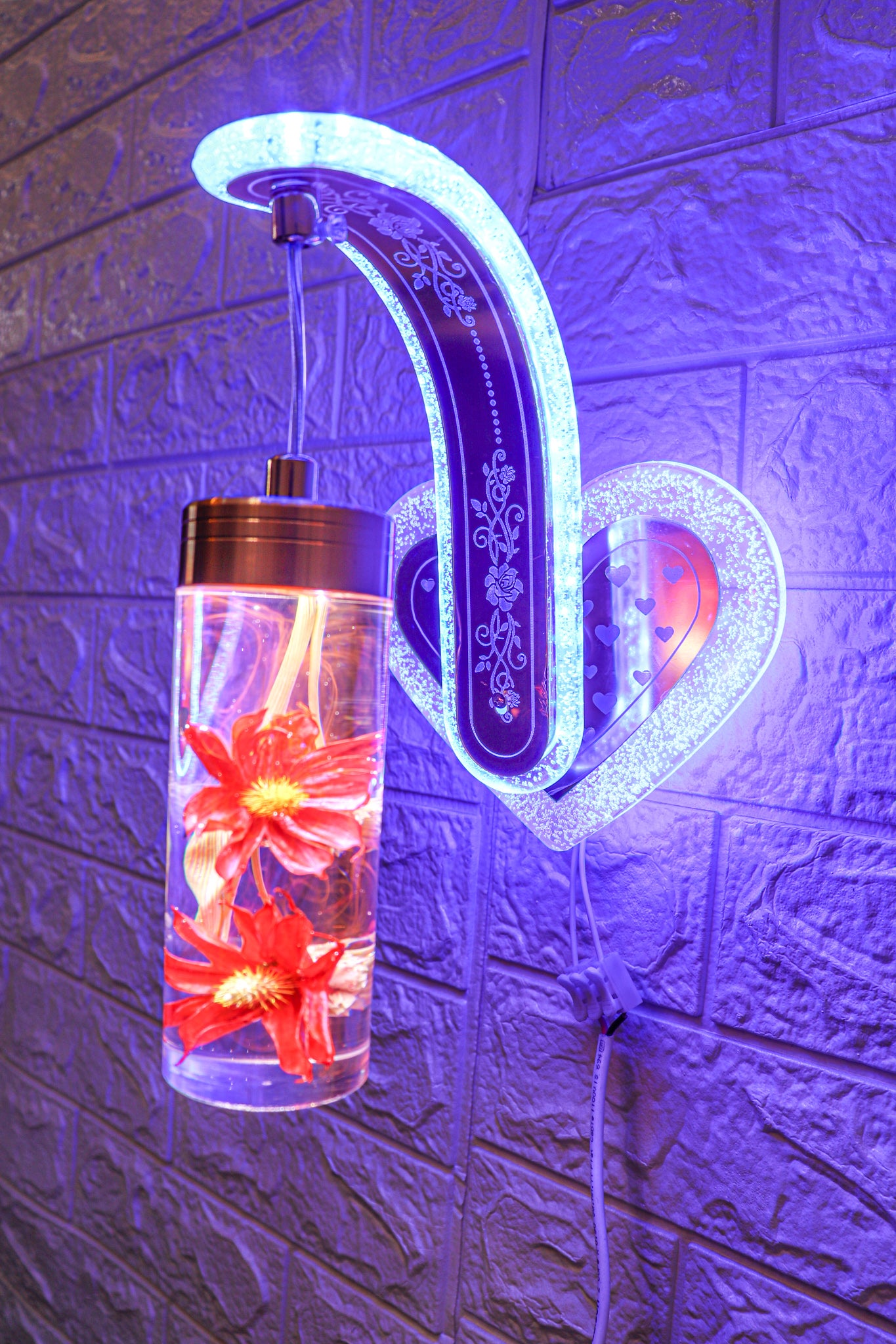 Swanart LED wall light with decorative heart design, floral glass cylinder, multi-color changing glow, ideal for bedroom or living room decor.