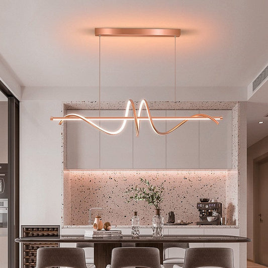 Swanart modern wave LED pendant light in gold and rose gold, 100cm linear hanging chandelier over a dining table or kitchen island