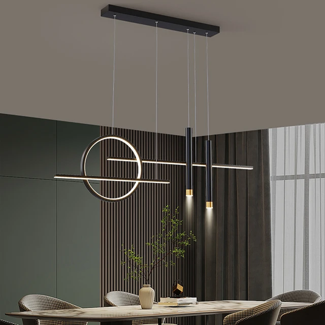 Swanart modern black and gold LED pendant light with linear ring design hanging above a dining table, warm white illumination.