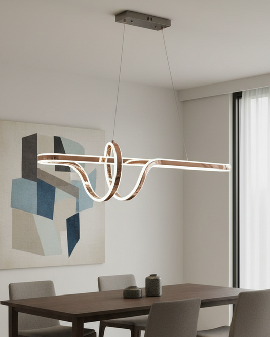 Swanart modern LED wave pendant chandelier hanging over a dining table, contemporary decorative lighting fixture in a stylish living room