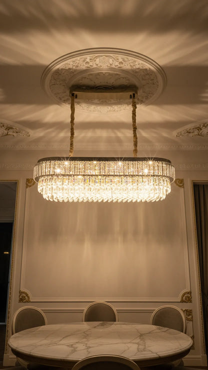Swanart luxury 4-layer crystal chandelier with rectangular modern LED design, hanging over a dining table in a stylish living room.