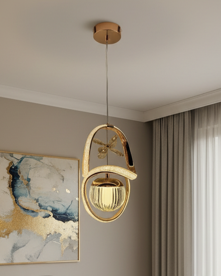 Swanart Virello modern gold pendant light with crystal glass shade hanging from ceiling in a stylish living room setting
