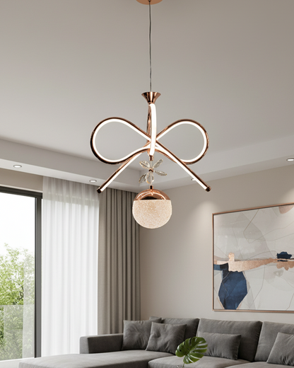 Swanart modern infinity loop LED pendant chandelier with rose gold finish, glass globe, and crystal accents for living or dining room lighting