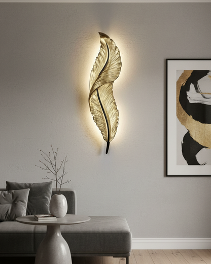Swanart modern feather LED wall light with golden metal design, warm white ambient lighting, ideal for living rooms, bedrooms, or hallways.