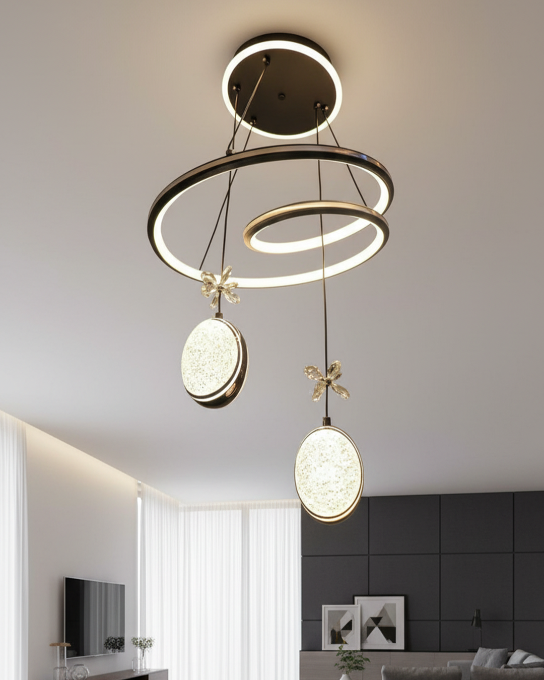 Modern Swanart hanging light fixture with a sleek, stylish design, illuminated in a creative studio setting.