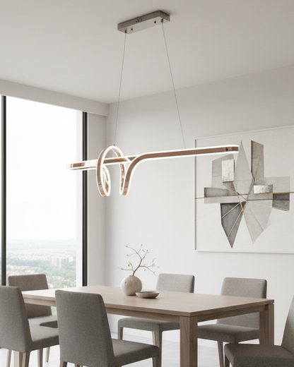 Swanart modern LED wave pendant chandelier hanging above a dining table, featuring sleek, artistic design for contemporary living rooms