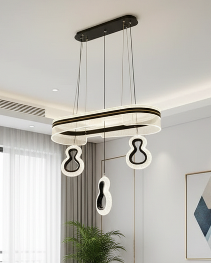 Modern Swanart LED pendant chandelier with black and gold acrylic finish, adjustable hanging ceiling light for living room or dining area.