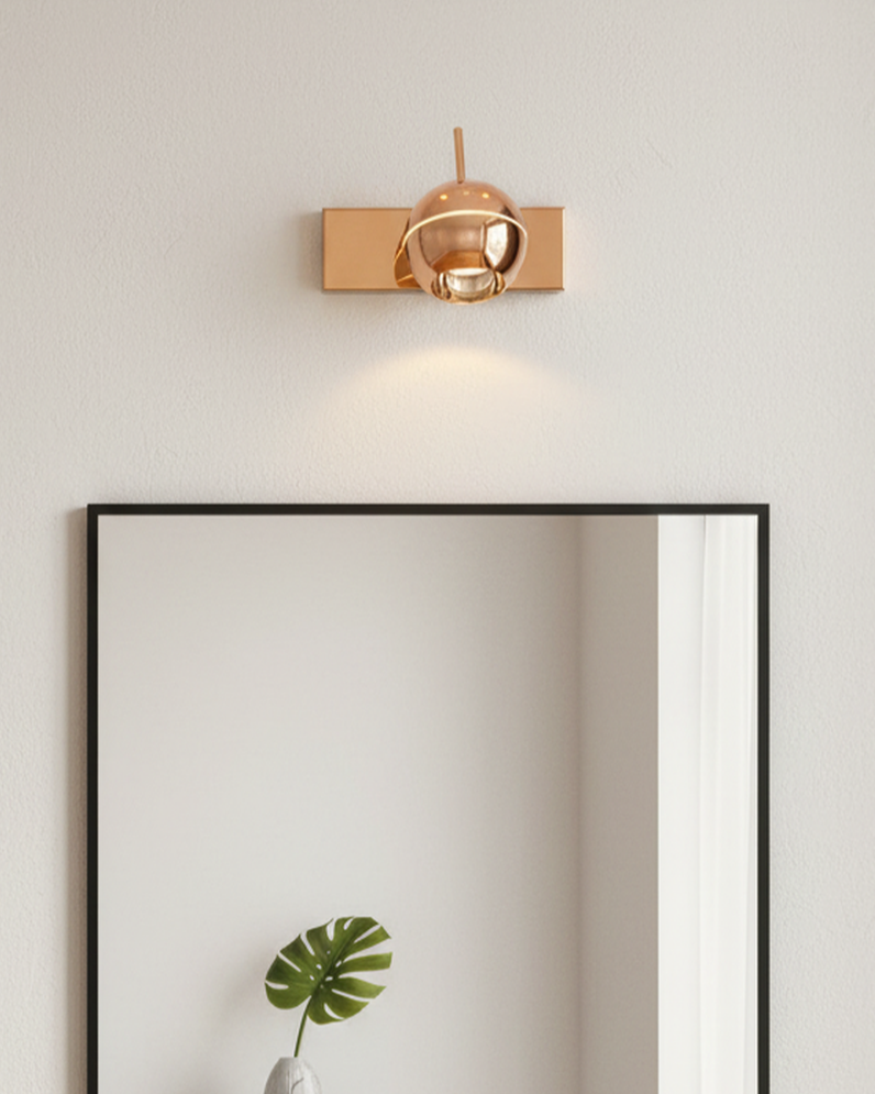 Swanart modern rose gold wall sconce with adjustable LED globe shade, suitable for living room, bedroom, or office decor.
