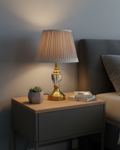 Swanart modern crystal bedside table lamp with fabric shade, gold base, emitting warm light for bedroom or living room décor.