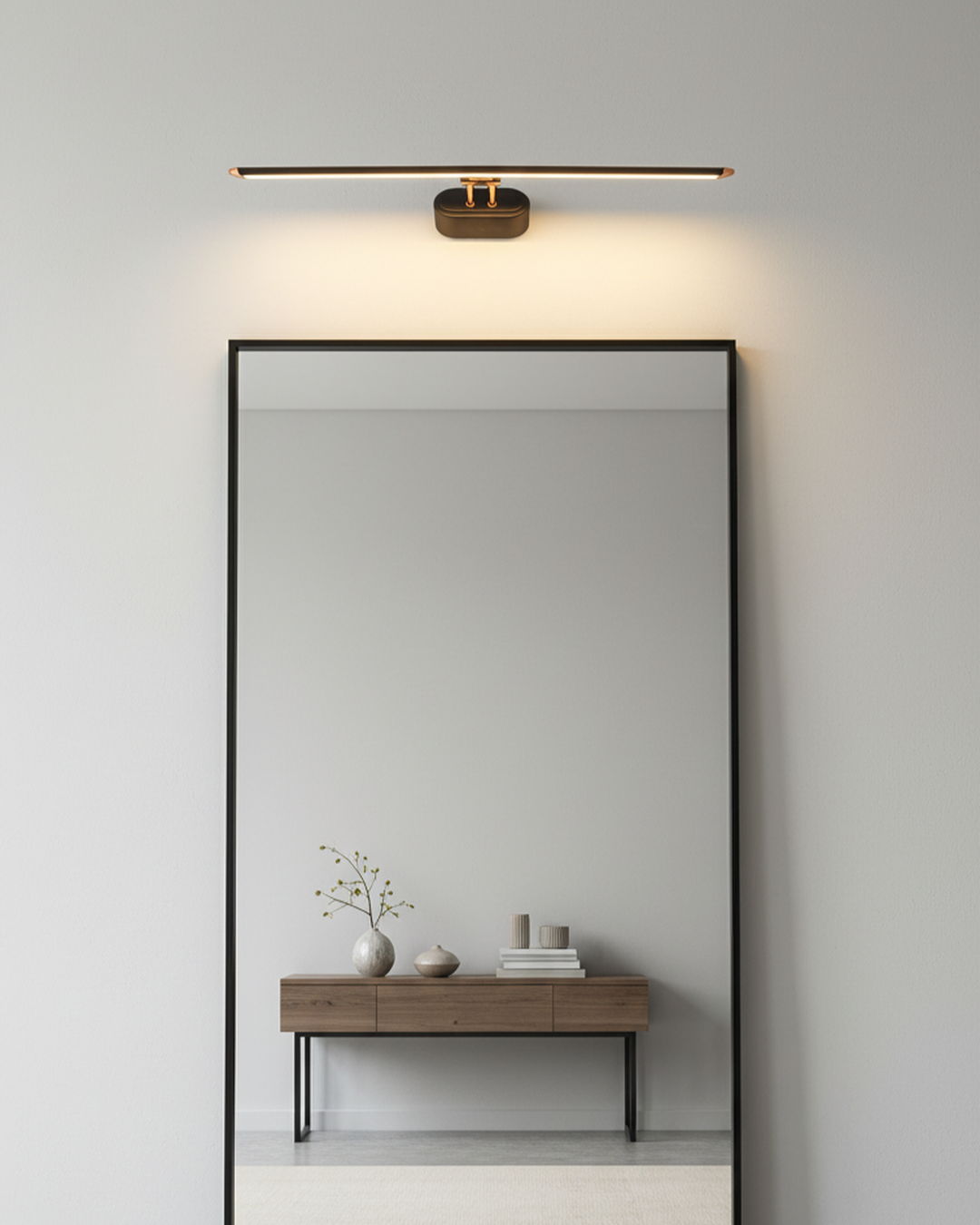 Swanart modern LED mirror light attached to a bathroom vanity mirror, warm white illumination, metal wall-mounted design.