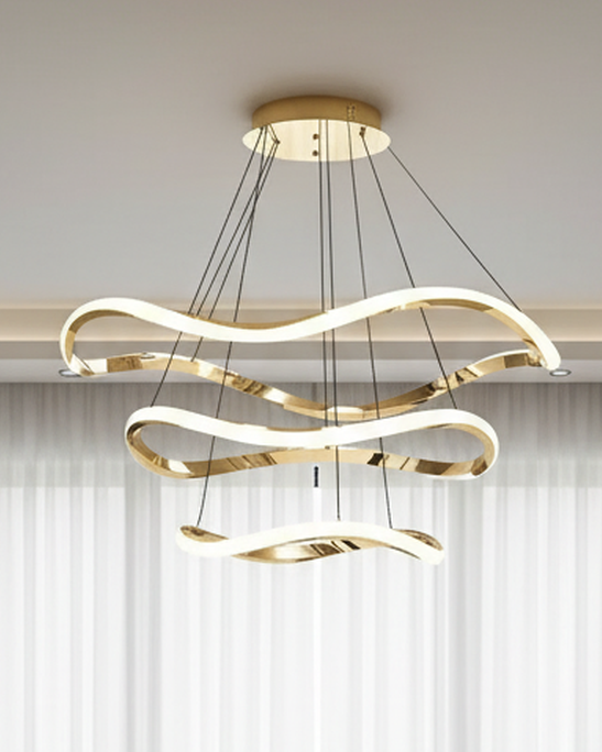 Swanart modern LED hanging pendant light with wave design, gold finish, 3-color dimmable LED ceiling fixture in a contemporary living room setting.