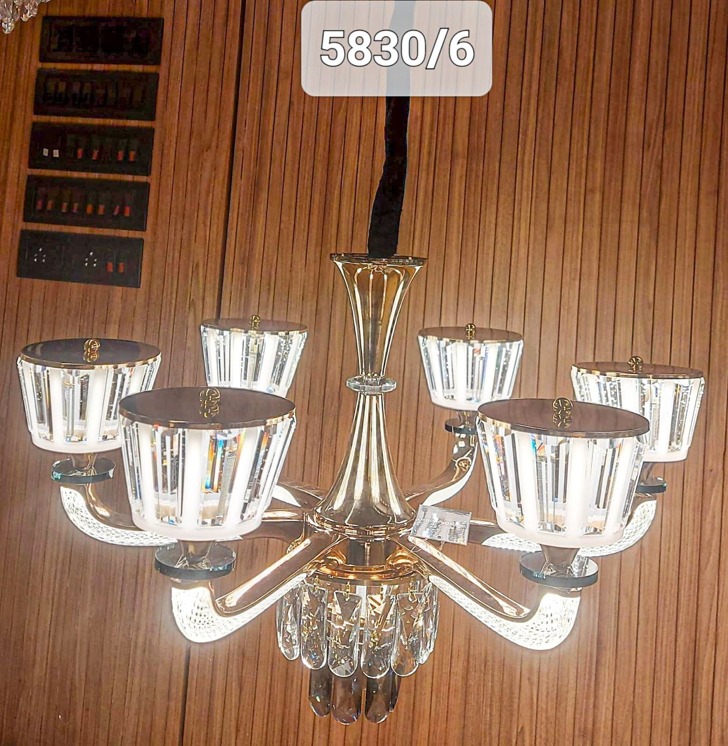 Modern Swanart chandelier light with sleek design and multiple bulbs, hanging from a ceiling fixture.